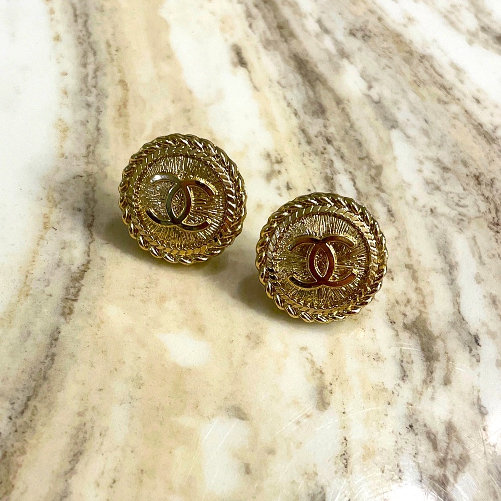 Chanel button earrings.